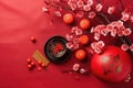 Chinese New Year festival decorations, mandarins, flowers, envelopes . Flat lay, top view. AI Generated Royalty Free Stock Photo