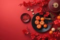 Chinese New Year festival decorations, mandarins, flowers, envelopes . Flat lay, top view. AI Generated Royalty Free Stock Photo