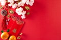 Chinese new year festival decorations pow or red packet, orange and gold ingots or golden lump on a red background. Chinese Royalty Free Stock Photo
