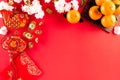 Chinese new year festival decorations pow or red packet, orange and gold ingots or golden lump on a red background. Chinese Royalty Free Stock Photo