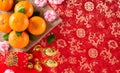 Chinese new year festival decorations pow or red packet, orange and gold ingots, golden lump on a red background. Chinese Royalty Free Stock Photo