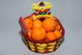 Chinese New Year mandarin oranges in basket decorate with Chinese dragon, Spring festival,ang pao Royalty Free Stock Photo