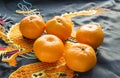 Chinese New year, mandarins in silk fabric with embroidered dragon Royalty Free Stock Photo