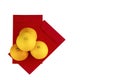 Chinese new year oranges and red angpao pocket on clear white background Royalty Free Stock Photo