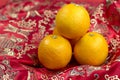 Chinese new year oranges on red Chinese textile background