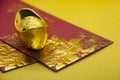 Chinese New Year packets with Chinese Gold Ingots on yellow background. With customizable space for text. Copy space