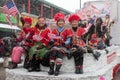 Chinese New Year Parade with Ladies Waving Flag Royalty Free Stock Photo