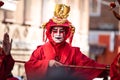 Chinese New Year parade in Usera neighborhood, Madrid. Spain. Close-up of a character painted as a Chinese god or devil in