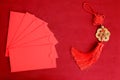 Chinese New Year, red envelope and lucky decorative golden coins with Chinese blessing words means happiness, richness and good