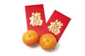 Chinese New Year Red Packets and Mandarins Royalty Free Stock Photo