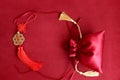 Chinese New Year, red silk pocket money bag and lucky decorative golden coins with Chinese blessing words means happiness,