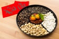 Chinese new year snack tray and chinese calligraphy, meaning for Royalty Free Stock Photo