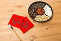 Chinese new year snack tray and chinese calligraphy, meaning for Royalty Free Stock Photo