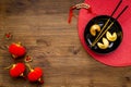 Chinese New Year tabble setting with fortune cookies and golden chopsticks Royalty Free Stock Photo