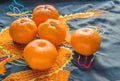 Chinese new year, tangerines are a rich silk fabric with an embroidered dragon