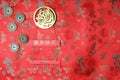 Chinese New Year of the Tiger 2022. Golden tiger symbol, five lucky coins with chinese zodiac on red fabric with traditional Royalty Free Stock Photo