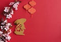 Chinese New Year, year of the rabbit. Year 2023 with golden rabbit and plum blossom fans. Copy space.