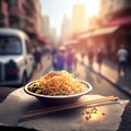 Chinese noodles in a bowl with chopsticks on a wooden table with blurred background Royalty Free Stock Photo