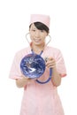 Asian nurse checking the health of the earth isolated on white background Royalty Free Stock Photo
