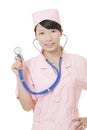 Portrait of a beautiful Asian nurse holding a stethoscope isolated on white background Royalty Free Stock Photo