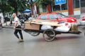 Chinese old man carry goods