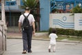 Chinese old man people walking relaxing with baby in garden at Zhongshan park in Shantou or Swatow city  in Guangdong, China Royalty Free Stock Photo