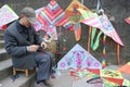 Chinese old man selling kite