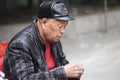 Chinese old man smoking and gambling in Hangzhou, China Royalty Free Stock Photo