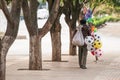 Chinese old man street vendor seller ball and other toys on the Royalty Free Stock Photo