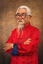 Chinese old man wearing eyeglasses with white hair and beard