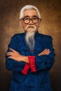 Chinese old man wearing eyeglasses with white hair and beard