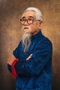 Chinese old man wearing eyeglasses with white hair and beard