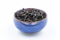 Chinese Oolong Dark Red tea WuYi Rou gui in a blue ceramic bowl Royalty Free Stock Photo