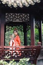 Chinese opera woman.Practicing Peking Opera in the Pavilion garden, Hand in a fan , Colorful, china Royalty Free Stock Photo