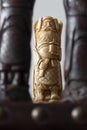 Chinese oriental chess pieces, with the white king Emporer between two black pieces. Royalty Free Stock Photo