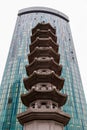 Chinese pagoda in front of a modern skyscraper Royalty Free Stock Photo