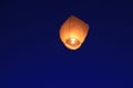 Chinese paper lantern flying in the blue sky. Royalty Free Stock Photo