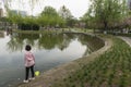 Chinese park scenery, people wearing mask