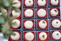 Chinese pastries are in a box with red paper