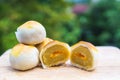 Chinese pastry puff, Beans cake with salted egg yolk lay on wood Royalty Free Stock Photo