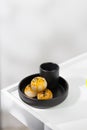 Chinese pastry and hot tea in a black ceramic cup Royalty Free Stock Photo