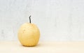 Chinese pear still life on concrete wall and plywood background