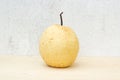 Chinese pear still life on concrete wall and plywood background