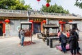 Chinese people buring the joss sticks and doing worship at the Chinese Guanyu temple in Nantou Ancient Town, Shenzhen, China