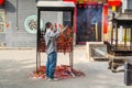 Chinese people buring the joss sticks and doing worship at the Chinese Guanyu temple in Nantou Ancient Town, Shenzhen, China