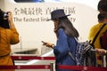 Chinese people and foreigner traveler waiting line up buy Buses ticket from tickets counter at Hong Kong Airport