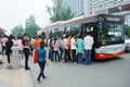 Chinese people line up on the bus