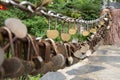 Chinese people padlocks engraved with the names of lovers Lovers person showing love by use master key lock on steel chain Royalty Free Stock Photo