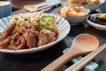 Chinese pork dish on table with side dishes Royalty Free Stock Photo