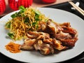 Chinese pork ears with vegetables and thin straws of French fries Royalty Free Stock Photo